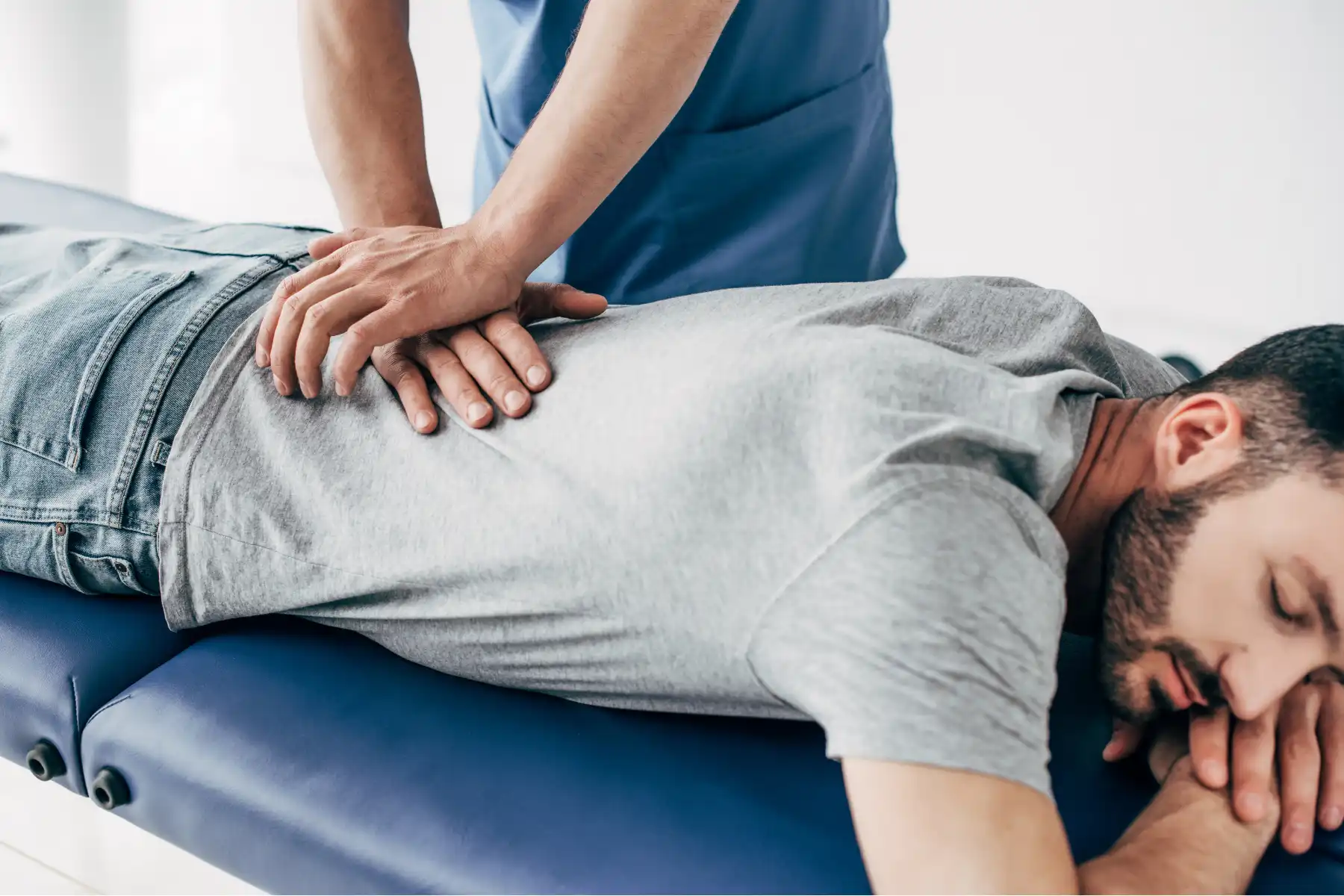 male chiropractic patient receiving treatment